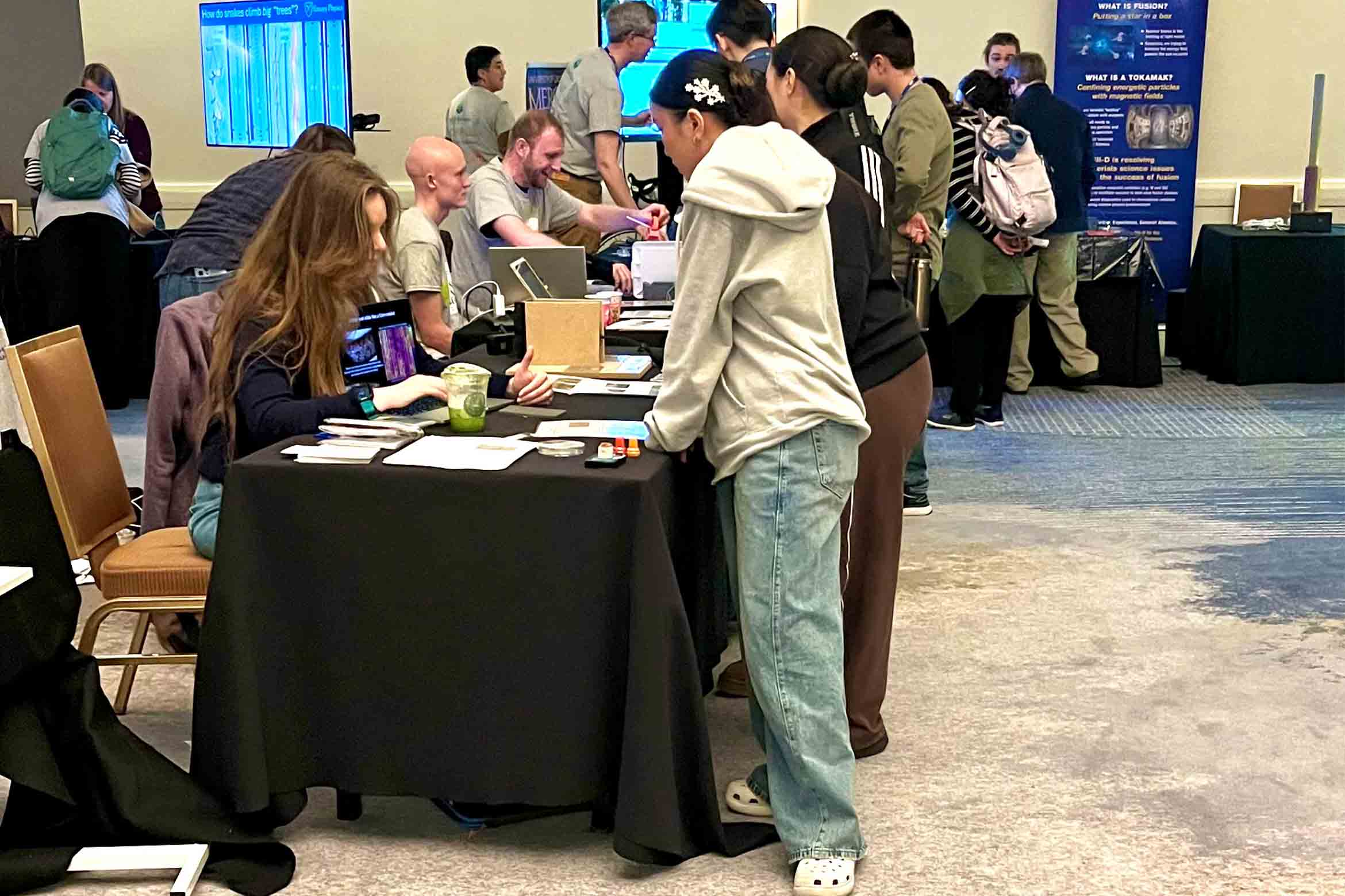 Group students showing demonstrations to children at the Squishy Physics event in Anaheim